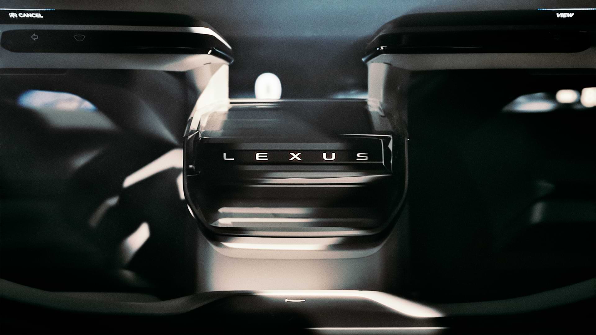 Closeup view of steering showing Lexus logo.